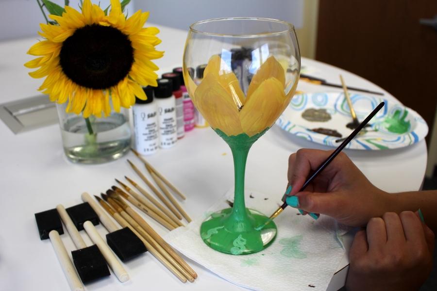 Painting sunflower on wine glass