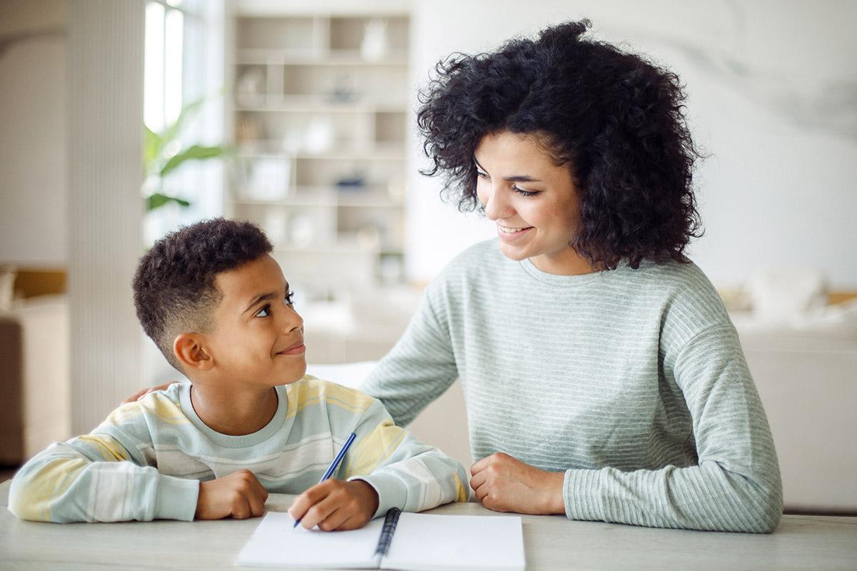 back to school moms mom helping son with homework