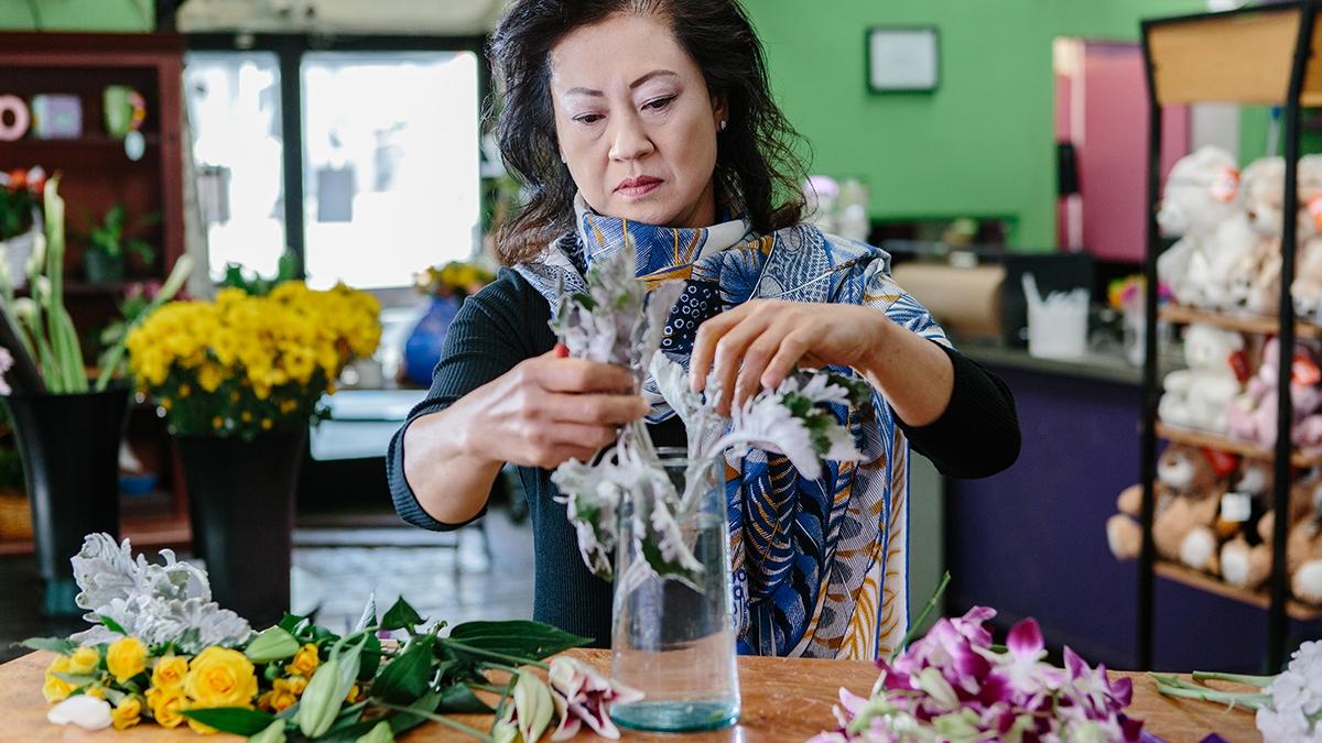 Local florist Vivian Chang arranges flowers at her Los Angeles area shop