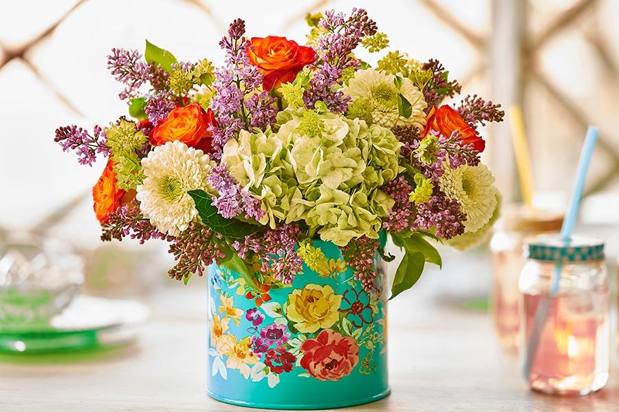 flowers arrangement in decorative tin