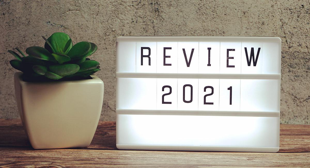 Review  word in light box on wooden background
