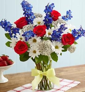 Memorial Day history with a bouquet of red, white, and blue flowers.