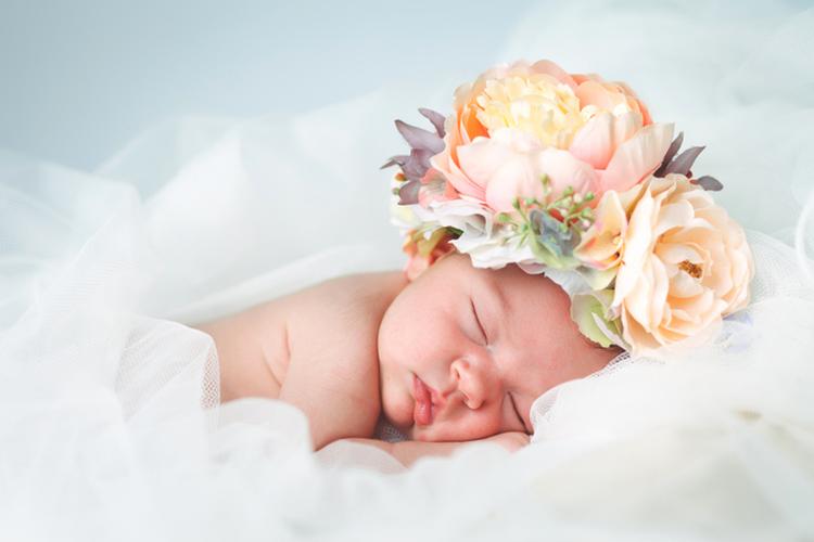 Flower Baby Names with baby with flower headpiece