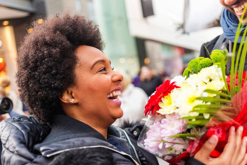 photo of International Day of Peace with a woman receiving flowers