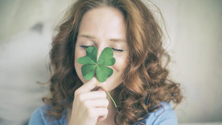 Woman with four leaf clover