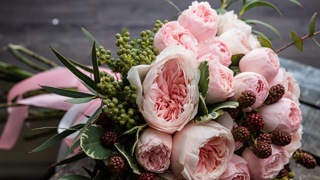 Wedding flower symbolism with Wedding bouquet with peonies and roses