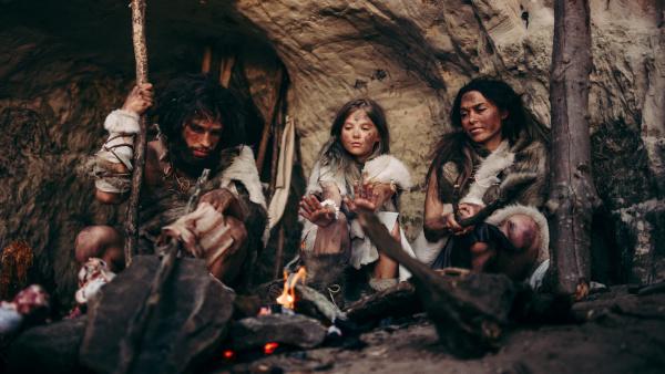 gift history with tribe of Prehistoric Primitive Hunter Gatherers in a Cave at Night