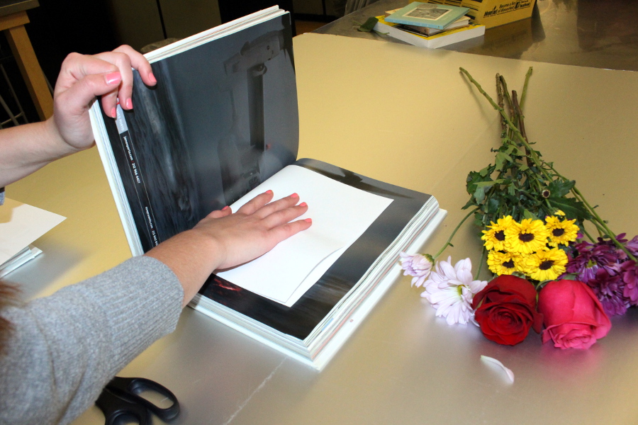 pressed flowers with closing book on flowers