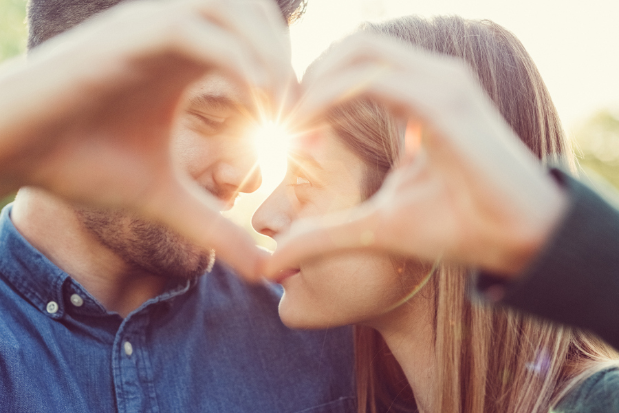 https://www.flowers.com/blog/wp content/uploads///couple making a heart with their hands