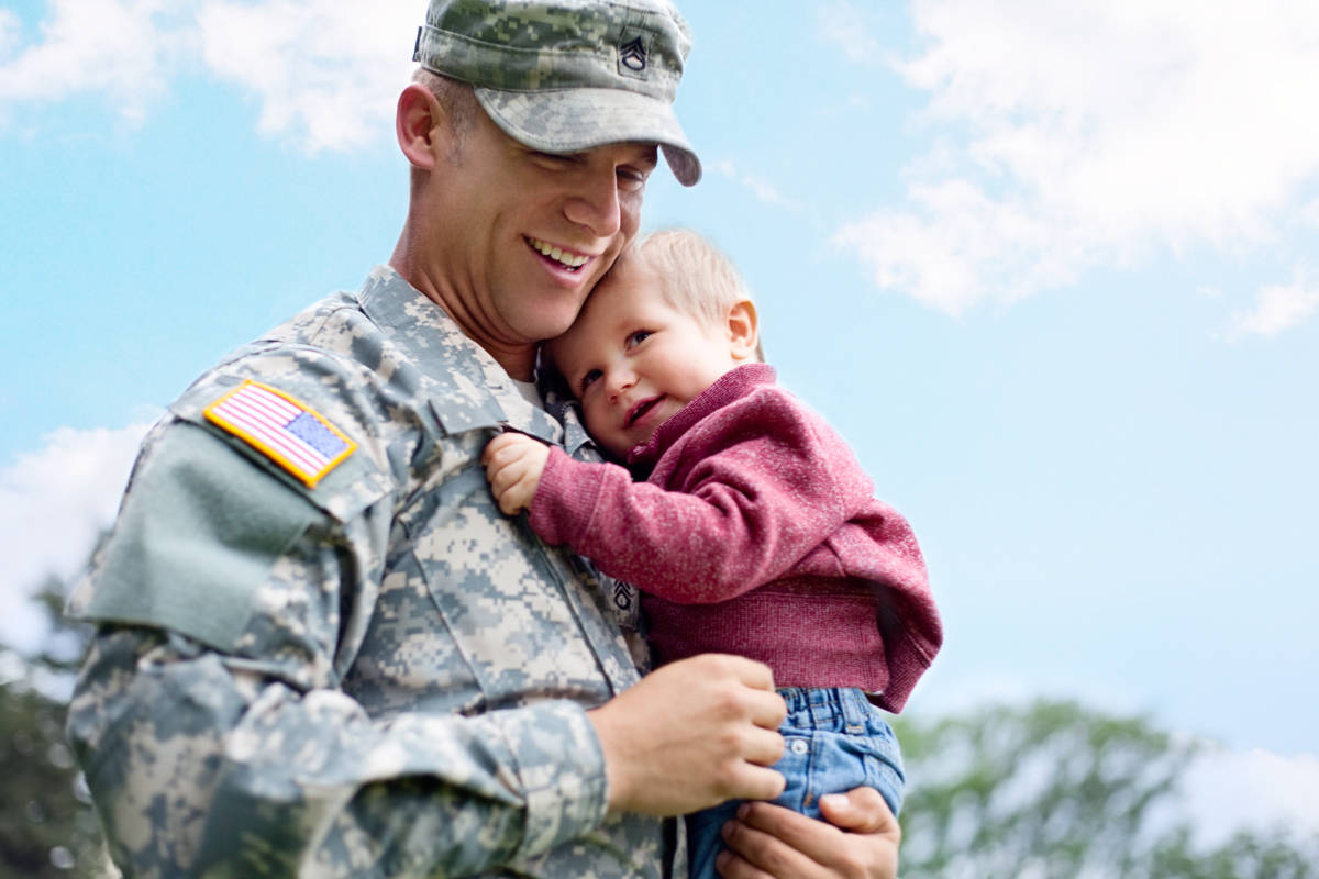 Soldier Holding Son