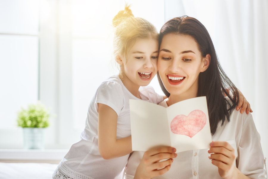 mother and daughter reading card message