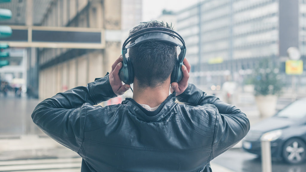 man listening to headphones