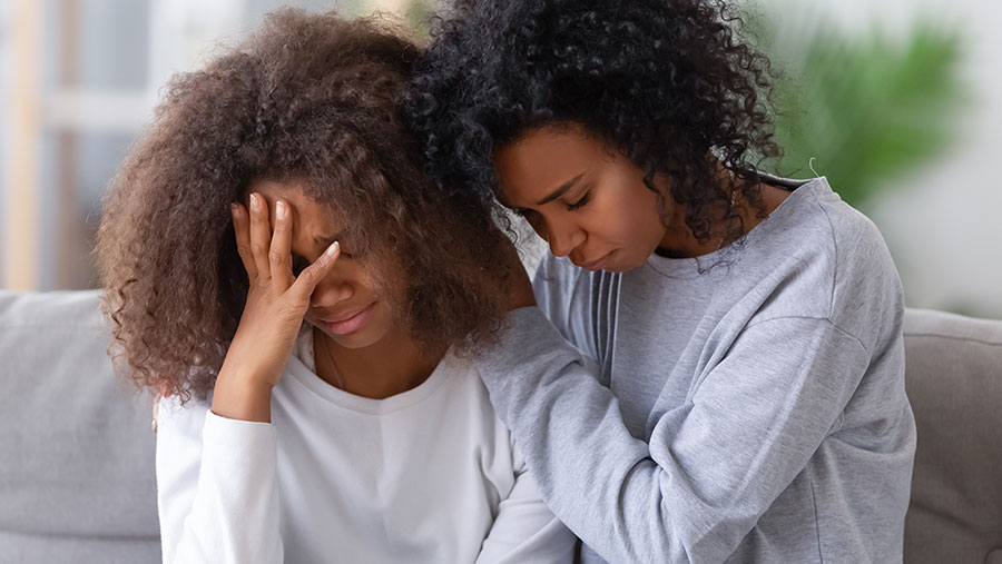 Two women grieving