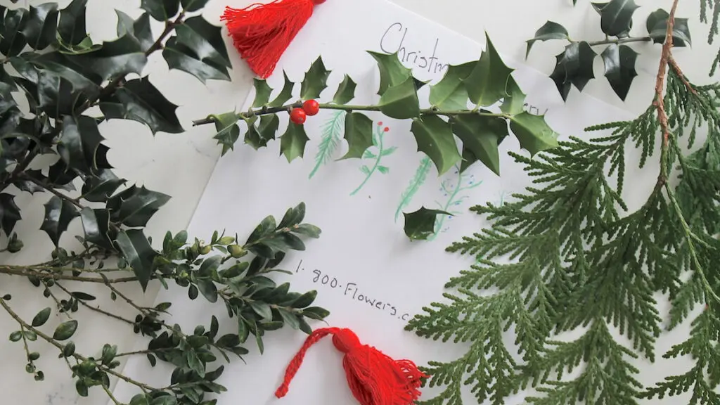 Garland from Branches of Holly with Red Berries. Christmas Decor