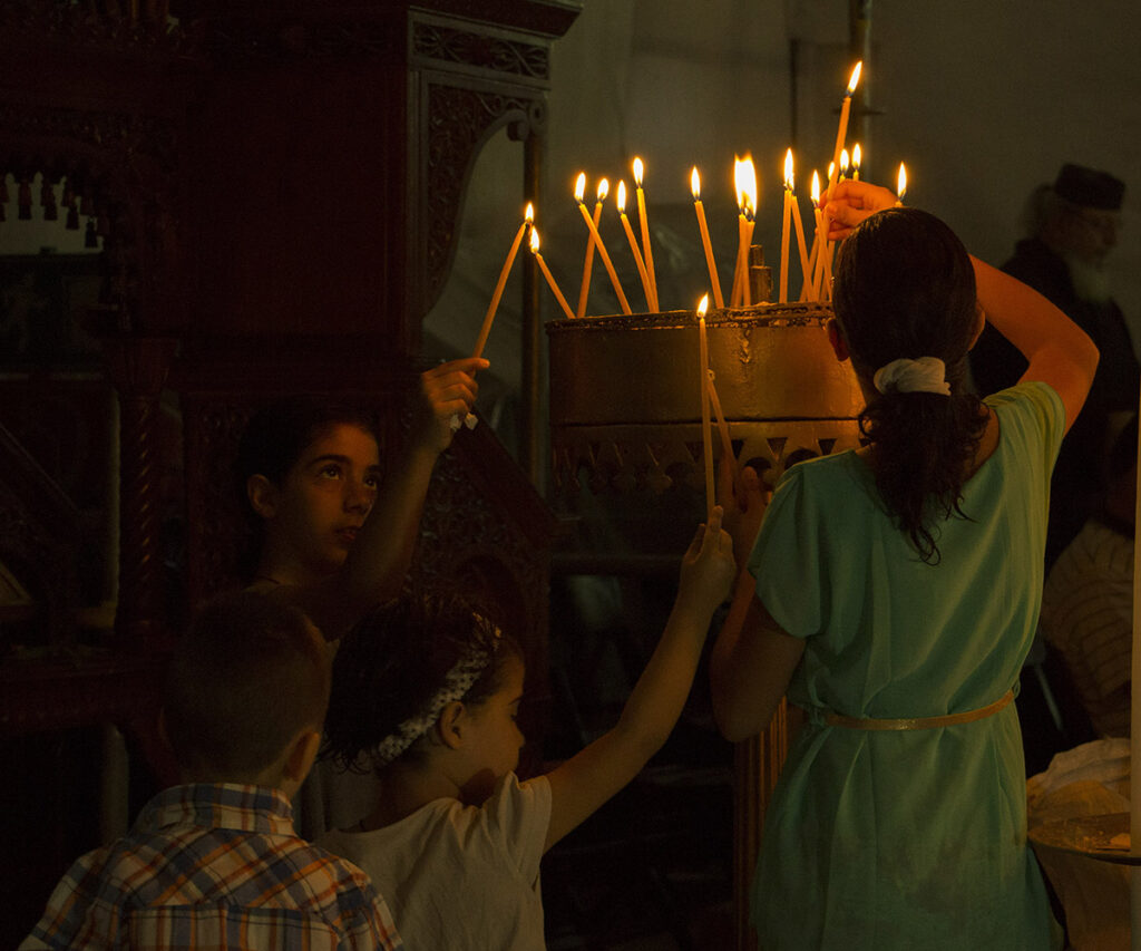 https://www.flowers.com/blog/wp content/uploads///christmas around the world palestine The four praying children Nativity Church Bethlehem by Pierre Janineh is licensed under CC BY NC SA . x