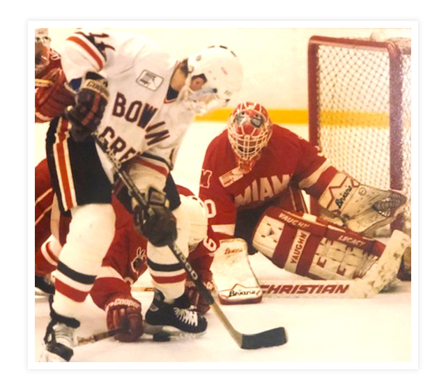 Photo of Chuck Thuss playing hockey.