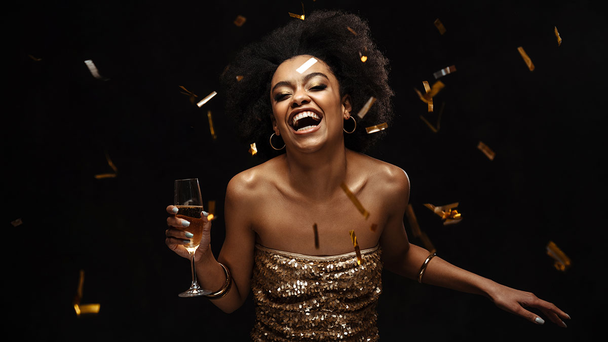 birthday gifts for taurus with woman partying and drinking champagne