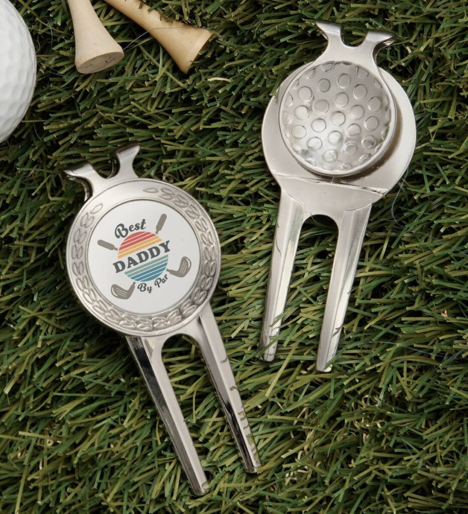 https://www.1800flowers.com/blog/wp-content/uploads/2023/05/golf-gift-ideas-with-Personalized-Divot-Tool-Ball-Marker-Clip-932x1024.jpg
