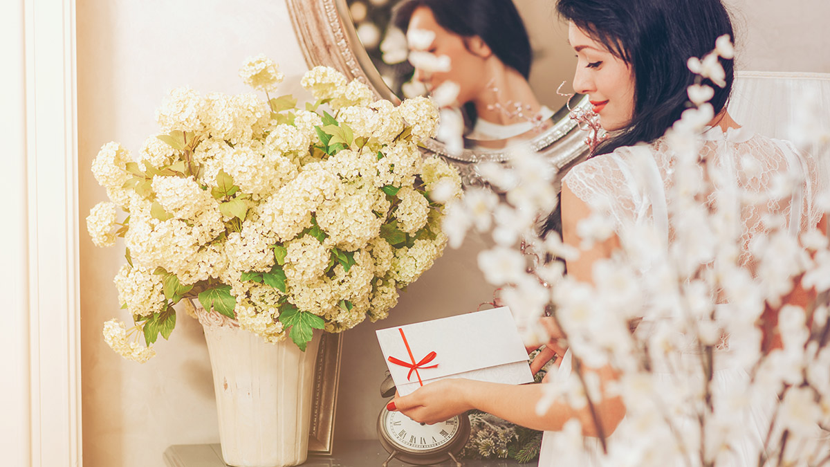 Woman holding a white card